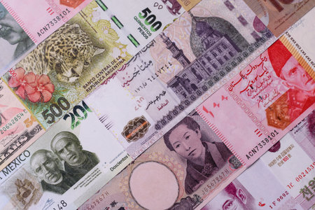 Paper money, banknotes of different countries in several denominations as a business background. Paper money and cash as a financial background for your design.の写真素材