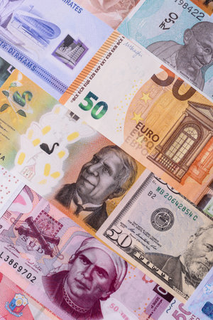 Paper money, banknotes of different countries in several denominations as a business background. Paper money and cash as a financial background for your design.の写真素材
