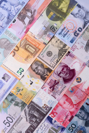 Paper money, banknotes of different countries in several denominations as a business background....