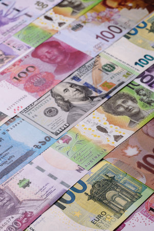 Paper money, banknotes of different countries in several denominations as a business background. Paper money and cash as a financial background for your design.の写真素材