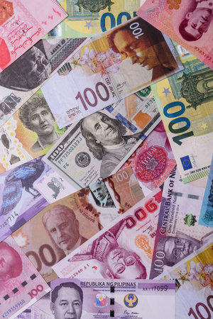 Paper money, banknotes of different countries in several denominations as a business background....