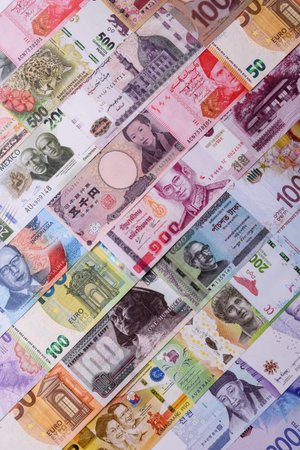 Paper money, banknotes of different countries in several denominations as a business background. Paper money and cash as a financial background for your design.の写真素材