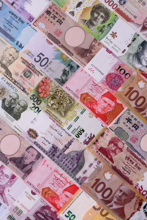 Paper money, banknotes of different countries in several denominations as a business background. Paper money and cash as a financial background for your design.の写真素材
