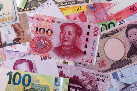Paper money, banknotes of different countries in several denominations as a business background. Paper money and cash as a financial background for your design.の写真素材