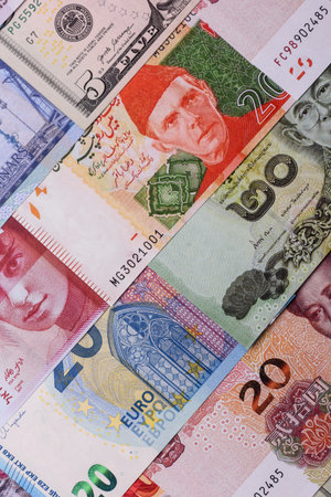 Paper money, banknotes of different countries in several denominations as a business background....