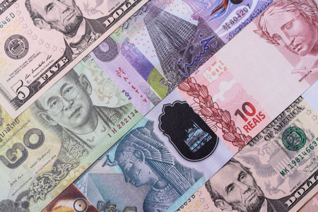 Paper money, banknotes of different countries in several denominations as a business background. Paper money and cash as a financial background for your design.の写真素材