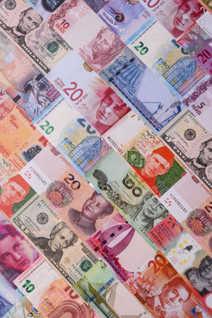 Paper money, banknotes of different countries in several denominations as a business background. Paper money and cash as a financial background for your design.の写真素材