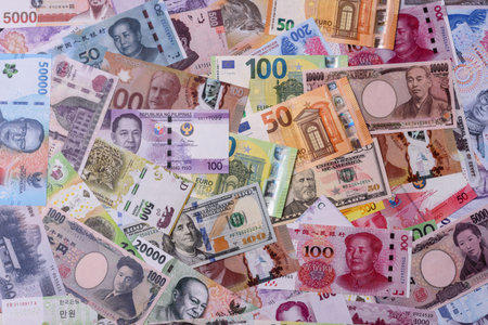Paper money, banknotes of different countries in several denominations as a business background. Paper money and cash as a financial background for your design.の写真素材