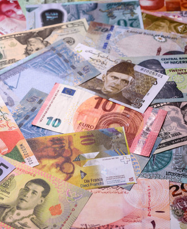 Paper money, banknotes of different countries in several denominations as a business background. Paper money and cash as a financial background for your design.の写真素材