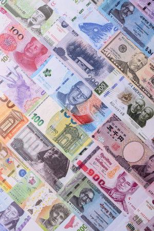 Paper money, banknotes of different countries in several denominations as a business background. Paper money and cash as a financial background for your design.の写真素材