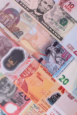Paper money, banknotes of different countries in several denominations as a business background....