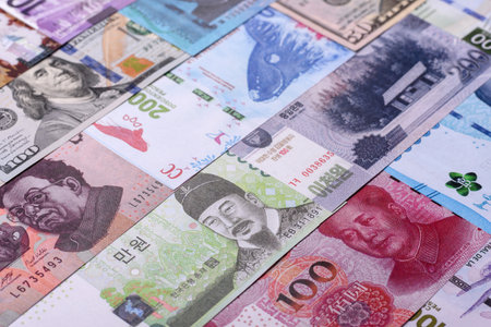 Paper money, banknotes of different countries in several denominations as a business background. Paper money and cash as a financial background for your design.の写真素材
