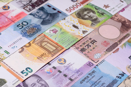 Paper money, banknotes of different countries in several denominations as a business background. Paper money and cash as a financial background for your design.の写真素材