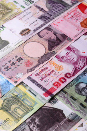 Paper money, banknotes of different countries in several denominations as a business background. Paper money and cash as a financial background for your design.の写真素材