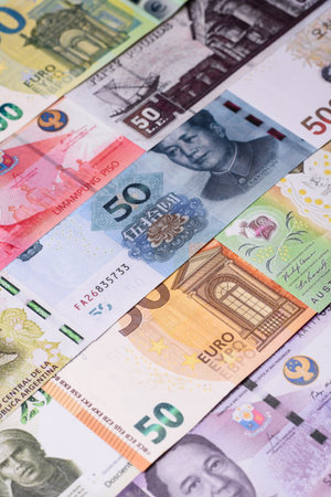 Paper money, banknotes of different countries in several denominations as a business background. Paper money and cash as a financial background for your design.の写真素材