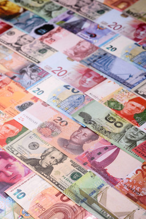 Paper money, banknotes of different countries in several denominations as a business background....