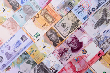 Paper money, banknotes of different countries in several denominations as a business background....