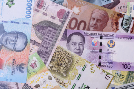 Paper money, banknotes of different countries in several denominations as a business background. Paper money and cash as a financial background for your design.の写真素材