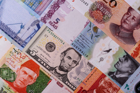 Paper money, banknotes of different countries in several denominations as a business background....