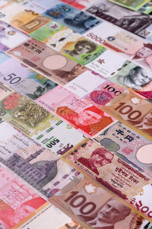 Paper money, banknotes of different countries in several denominations as a business background....