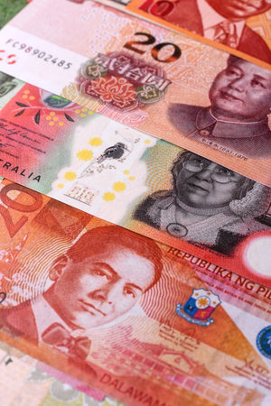 Paper money, banknotes of different countries in several denominations as a business background. Paper money and cash as a financial background for your design.の写真素材