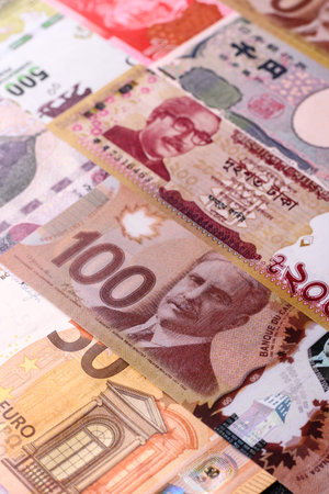 Paper money, banknotes of different countries in several denominations as a business background. Paper money and cash as a financial background for your design.の写真素材