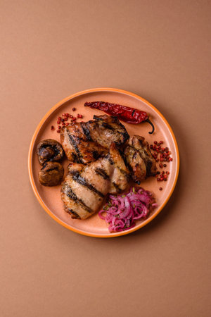 Chicken breast cooked on a grill or barbecue with sauce. Grilled chicken as a food backdrop for your designの写真素材