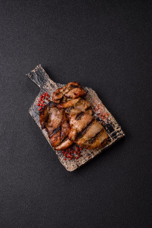 Chicken breast cooked on a grill or barbecue with sauce. Grilled chicken as a food backdrop for your designの写真素材