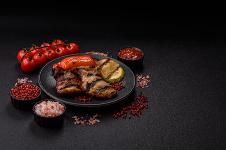 Chicken breast cooked on a grill or barbecue with sauce. Grilled chicken as a food backdrop for your designの写真素材