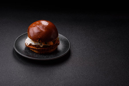 A burger, a hamburger with cheese, beef, and a bun, is takeaway food. A burger or cheeseburger as a...