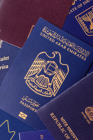 A background of several passports from different countries, an international ID card. Passports from...