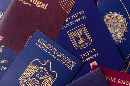 A background of several passports from different countries, an international ID card. Passports from different countries as a background for your designの写真素材