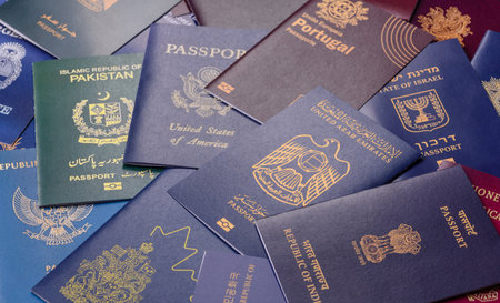 A background of several passports from different countries, an international ID card. Passports from different countries as a background for your designの写真素材