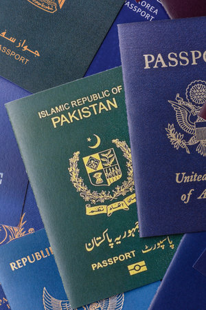 A background of several passports from different countries, an international ID card. Passports from...
