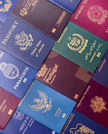 A background of several passports from different countries, an international ID card. Passports from different countries as a background for your designの写真素材