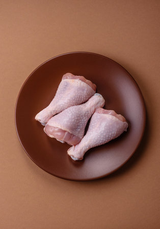 Raw chicken legs, poultry meat on the bone. Chicken legs as a background for your designの写真素材