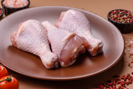 Raw chicken legs, poultry meat on the bone for barbecue. Chicken legs as a food background for your designの写真素材