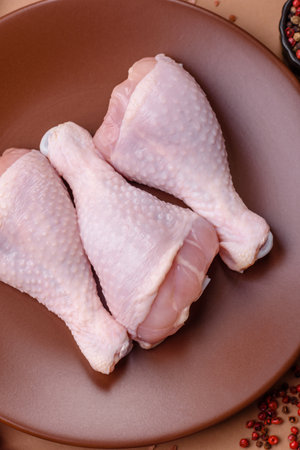 Raw chicken legs, poultry meat on the bone for barbecue. Chicken legs as a background for your designの写真素材