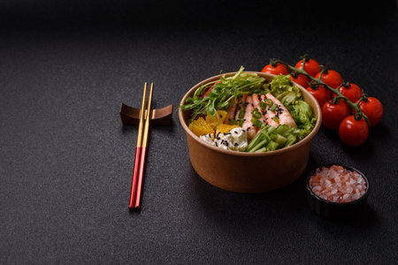 A prawn or shrimp bowl with rice, tomatoes, sauce, and vegetables, Asian food. Prawn or shrimp as a...