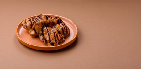 Grilled boneless chicken legs baked on the barbecue for lunch. Grilled chicken as a food background for your design.の写真素材