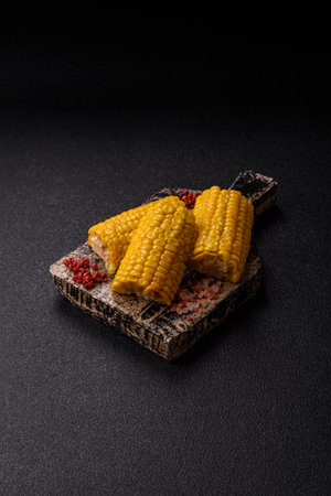 Corn cob cooked in chunks, vegetables, healthy vegetarian food. Boiled corn as a food background for...