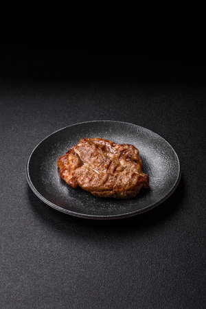 Grilled beef or pork steak, healthy restaurant food for lunch. Barbecue steak as a food background for your designの写真素材