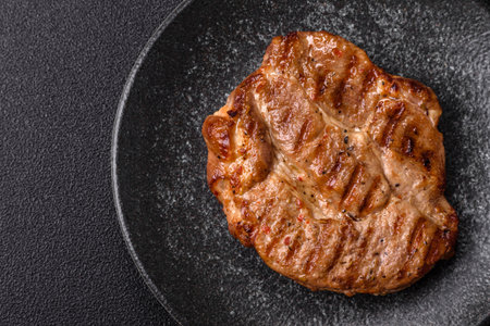 Grilled beef or pork steak, healthy restaurant food for lunch. Barbecue steak as a food background...