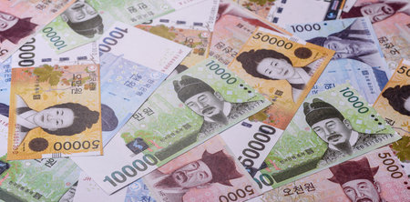 Korean paper money, won, and cash banknotes for financial and business transactions. Korean money as a background for your designの写真素材