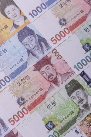 Korean paper money, won, and cash banknotes for financial and business transactions. Korean money as a background for your designの写真素材