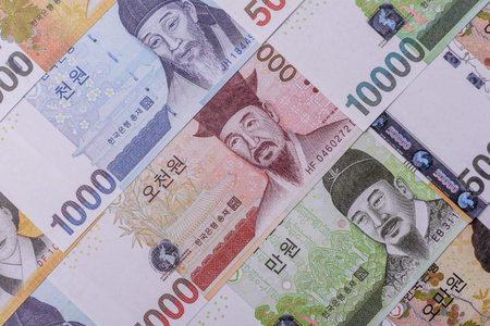 Korean paper money, won, and cash banknotes for financial and business transactions. Korean money as...