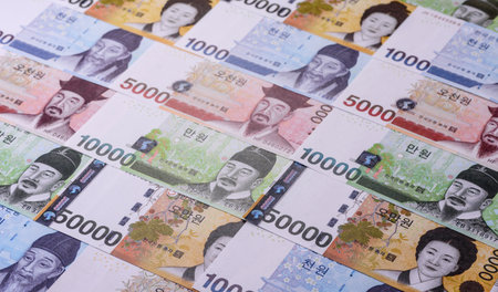 Korean paper money, won, and cash banknotes for financial and business transactions. Korean money as...