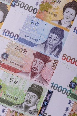 Korean paper money, won, and cash banknotes for financial and business transactions. Korean money as a background for your designの写真素材