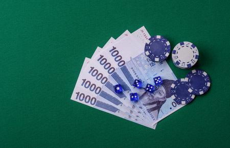 Casino game in South Korea, won money, chips, cards and other attributes. Gambling in casinos in Korea as a background for your designの写真素材