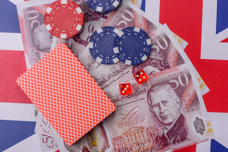 Casino game in the Great Britain, pound sterling money, chips, cards and other attributes. Gambling in casinos in the England as a background for your designの写真素材